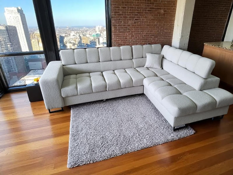 Ecksofa Tenaro L – formschön, mit Bettfunktion und leicht zu reinigendem Bouclé-Stoff.