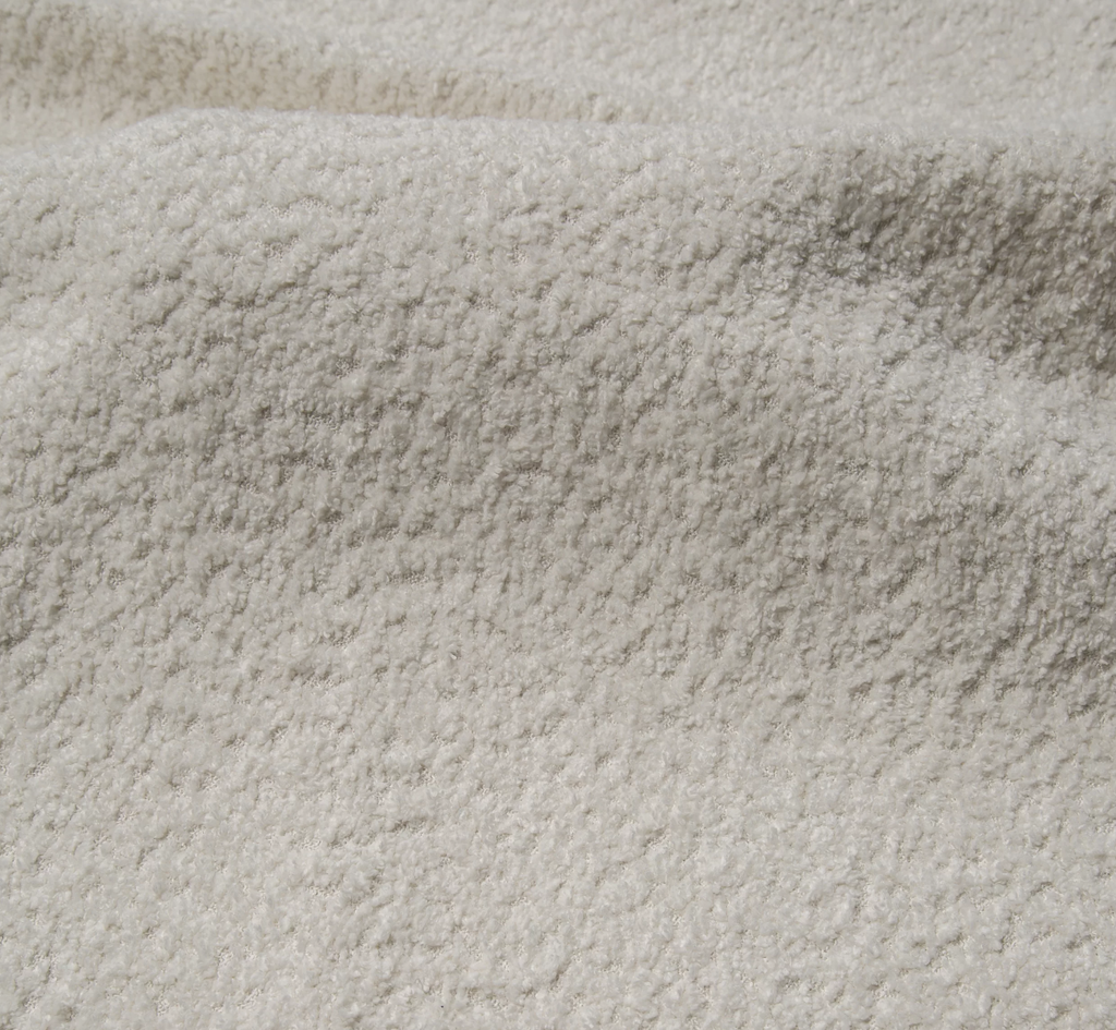 Narożnik Montivo L kształtny- z funkcja spania i pojemnikem na pościel tkanina boucle