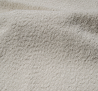 Narożnik Montivo L kształtny- z funkcja spania i pojemnikem na pościel tkanina boucle