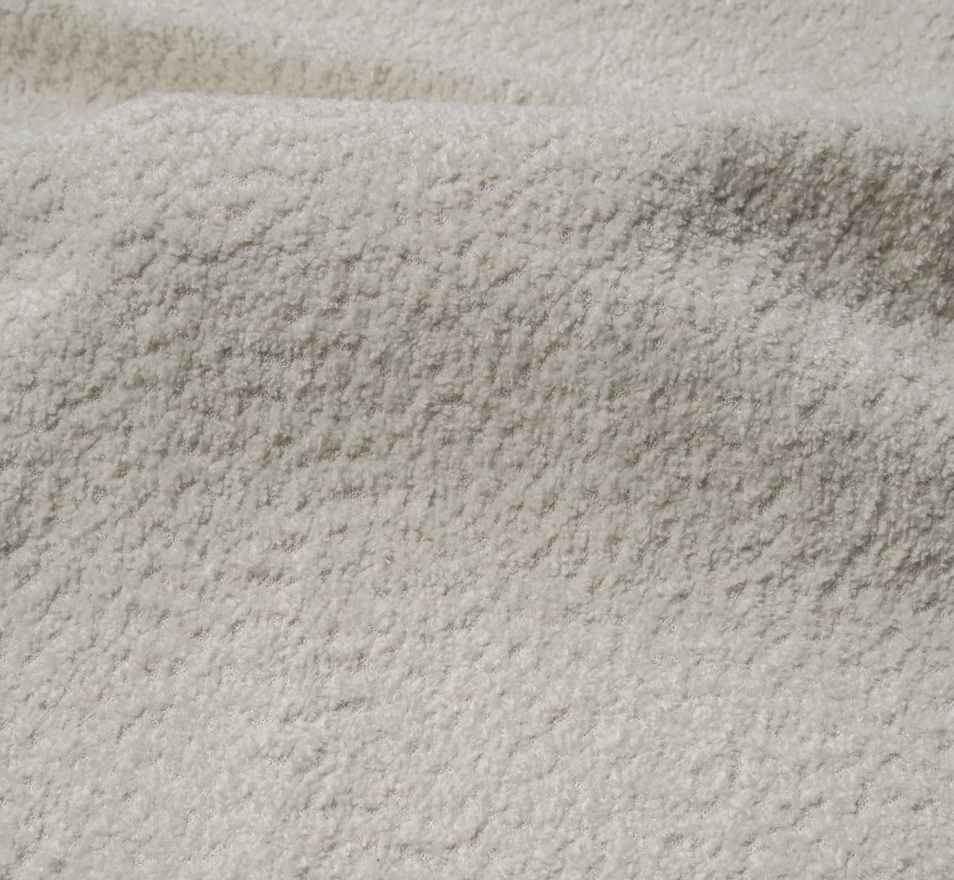 Narożnik Montivo L kształtny- z funkcja spania i pojemnikem na pościel tkanina boucle