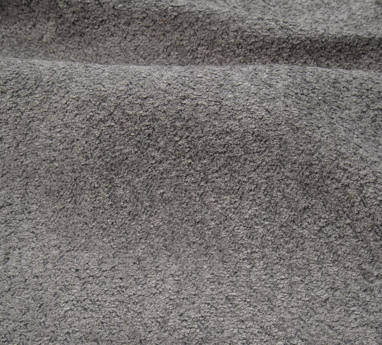 Narożnik Montivo L kształtny- z funkcja spania i pojemnikem na pościel tkanina boucle